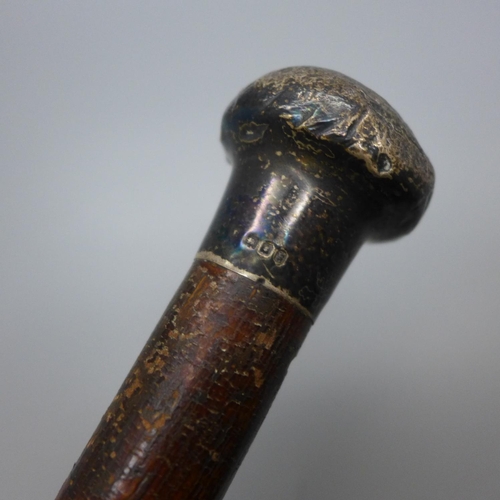 836 - A silver topped walking cane