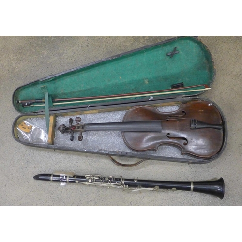 837 - A cased violin and a Boosey and Hawkes clarinet