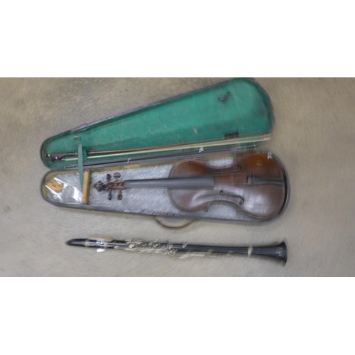 837 - A cased violin and a Boosey and Hawkes clarinet