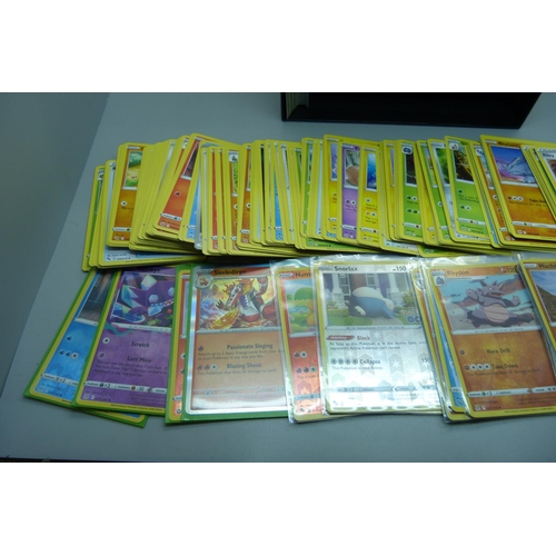 875 - 420 Pokemon cards including 20 holos and black star rare