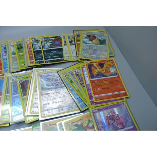 878 - 125 Holo and reverse holo Pokemon cards in protective sleeves including black star rares