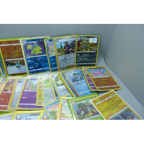 879 - 125 Holo and reverse holo Pokemon cards in protective sleeves including black star rares