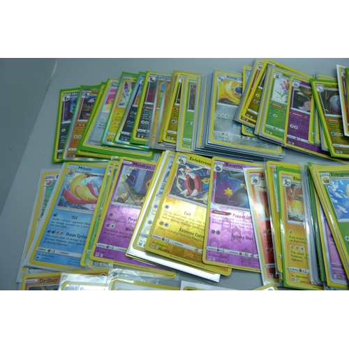 881 - 125 Holo and reverse holo Pokemon cards in protective sleeves including black star rares