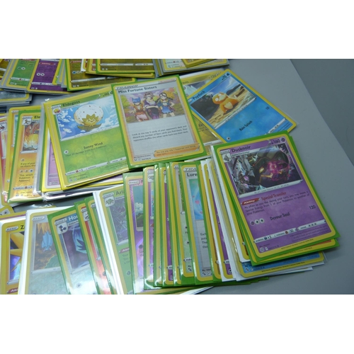 881 - 125 Holo and reverse holo Pokemon cards in protective sleeves including black star rares