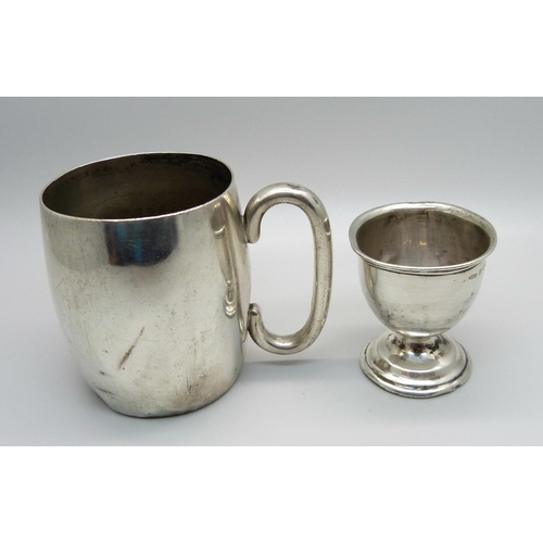 890 - A silver cup with inscription and a silver egg cup, a/f, 130g