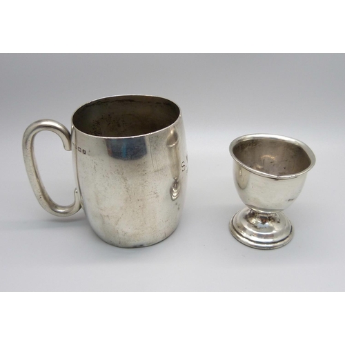 890 - A silver cup with inscription and a silver egg cup, a/f, 130g