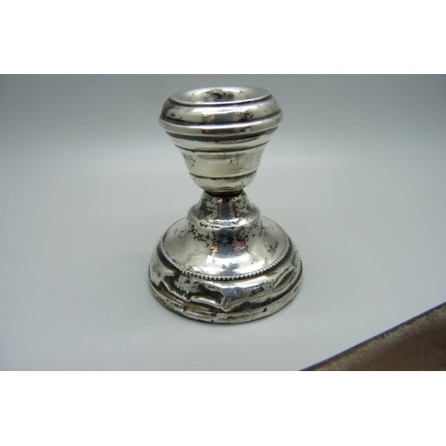 895B - A small silver candlestick, a/f, and a silver handled shoehorn, a/f