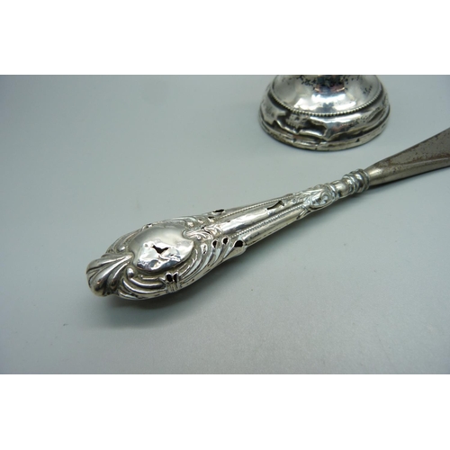 895B - A small silver candlestick, a/f, and a silver handled shoehorn, a/f