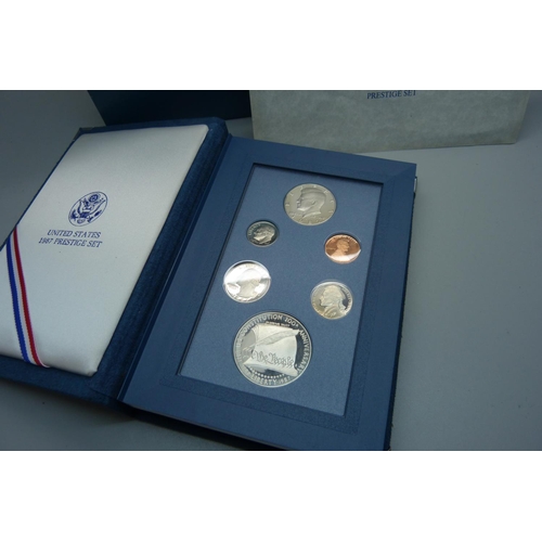 935 - A 1987 United States Prestige coin set, including a 900 silver 1 dollar