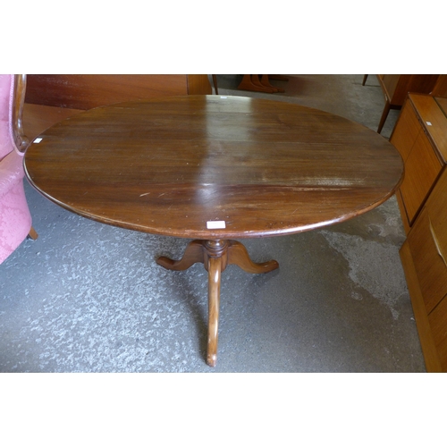 261 - A beech oval tripod loo table