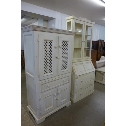 325 - A painted bureau bookcase and a cupboard