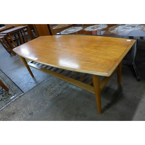 102 - A teak coffee table