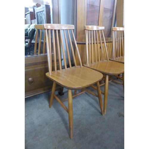 117 - A set of four beech kitchen chairs