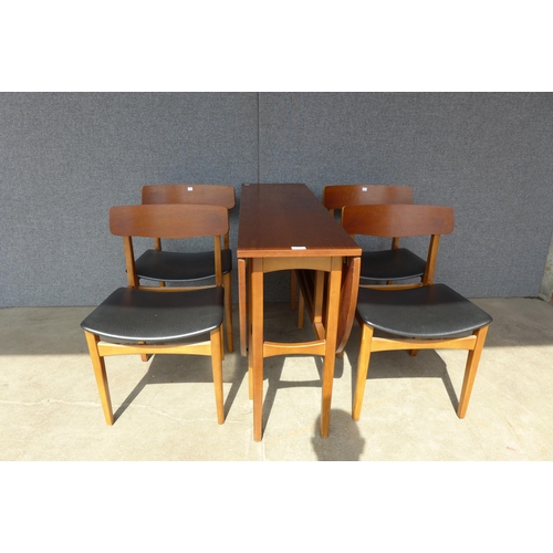 121 - A teak drop-leaf dining table and four chairs