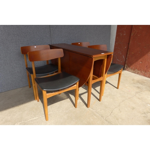 121 - A teak drop-leaf dining table and four chairs