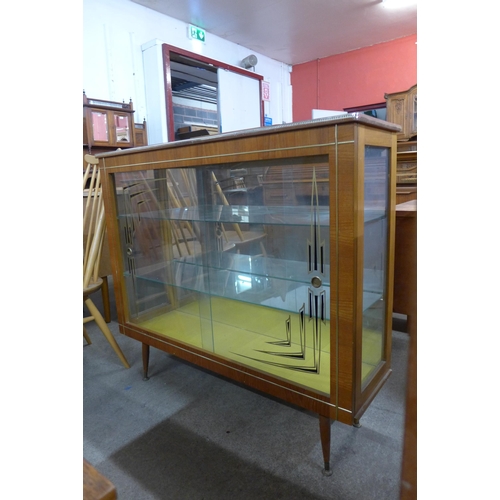 126 - A teak display cabinet