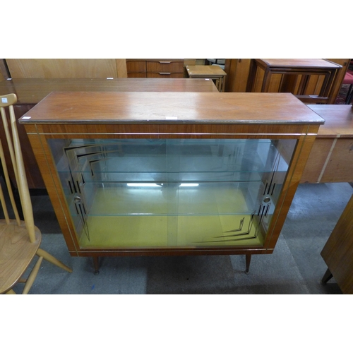 126 - A teak display cabinet