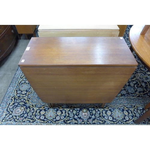 139 - A teak drop-leaf table