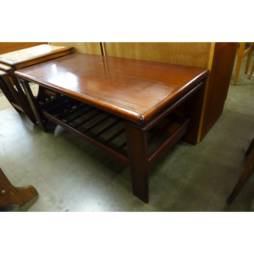 142 - A simulated rosewood coffee table