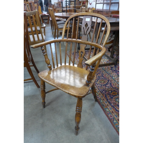 153 - A Victorian elm and beech Windsor chair, by F. Walker Rockley