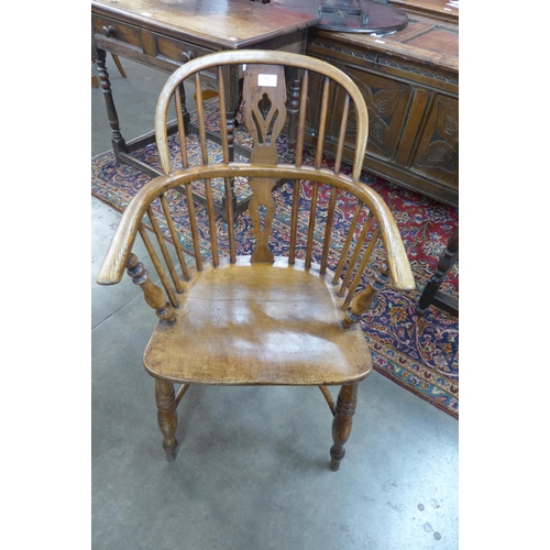 153 - A Victorian elm and beech Windsor chair, by F. Walker Rockley