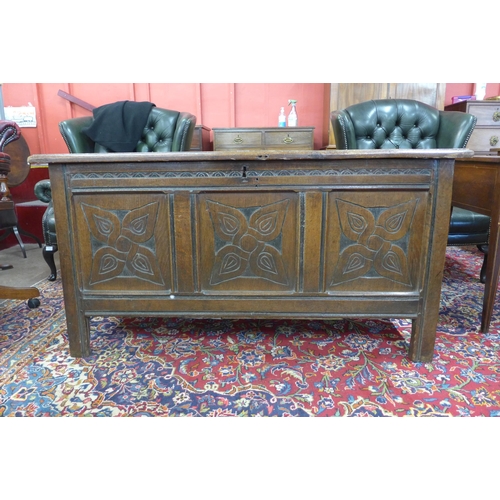 157 - A William III carved oak panelled coffer