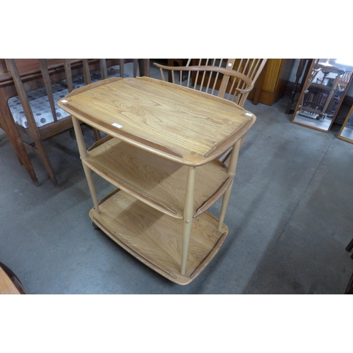 16 - An Ercol Blonde elm and beech Windsor trolley