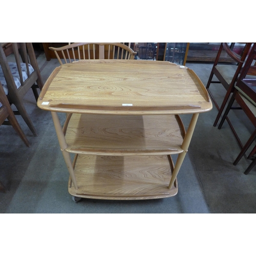 16 - An Ercol Blonde elm and beech Windsor trolley