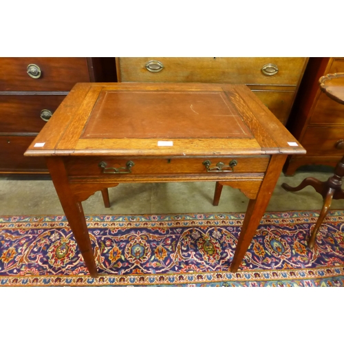 169 - An Arts and Crafts metamorphic Stones Patent oak writing table