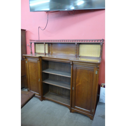 173 - A Victorian Aesthetic Movement walnut breakfront bookcase