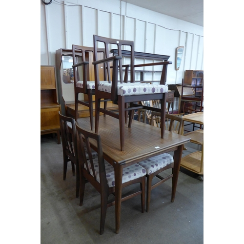 18 - A Younger afromosia extening dining table and six chairs, designed by John Herbert