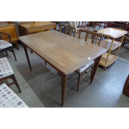 18 - A Younger afromosia extening dining table and six chairs, designed by John Herbert