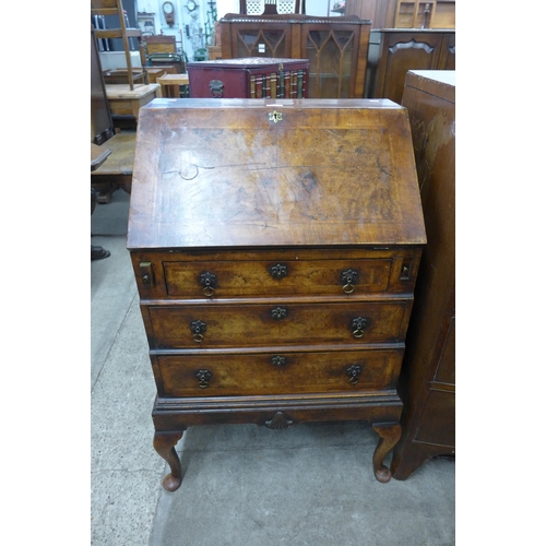 193 - A George I style figured walnut and feather banded bureau