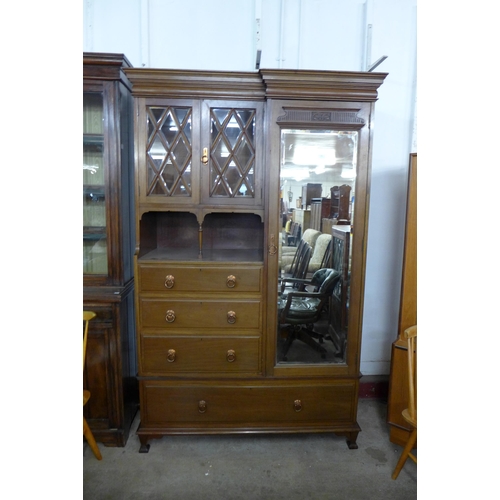 208 - An Arts and Crafts James Schoolbred & Co. walnut combination wardrobe