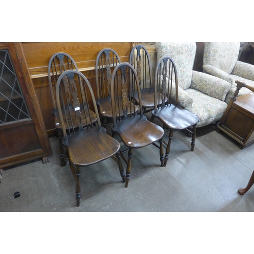 219 - A set of six elm and beech Windsor kitchen chairs