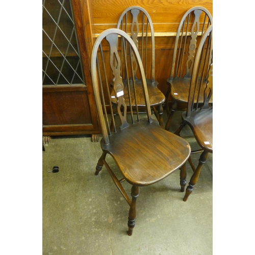 219 - A set of six elm and beech Windsor kitchen chairs