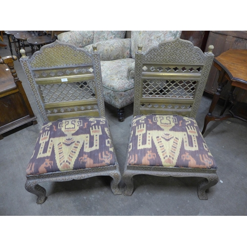 220 - A pair of Indian Rajastan brass chairs