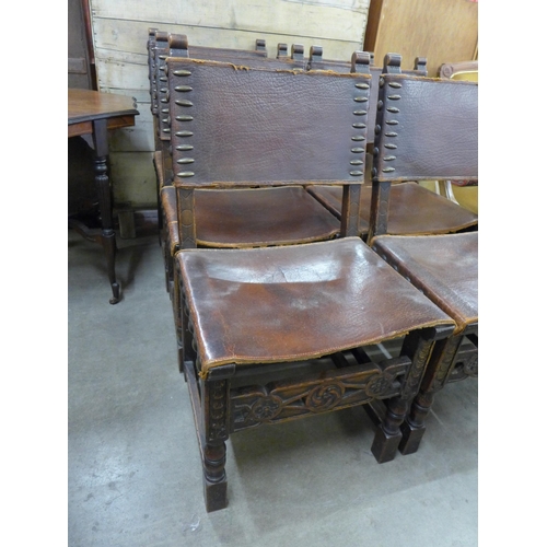 223 - A set of six 17th Century style oak and brown leather dining chairs