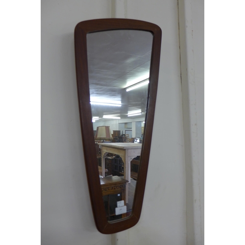 24 - A teak asymmetrical framed mirror