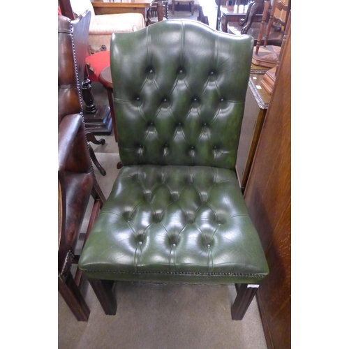 244 - A Regency style mahogany and green leather library chair