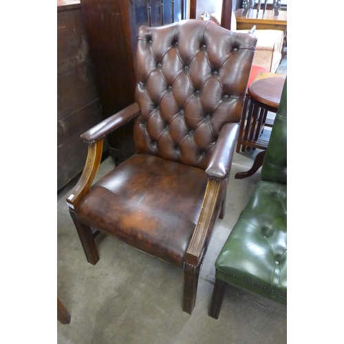 245 - A Regency style mahogany and chestnut brown leather library chair