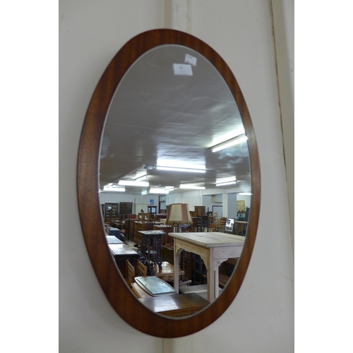 25 - A teak framed mirror