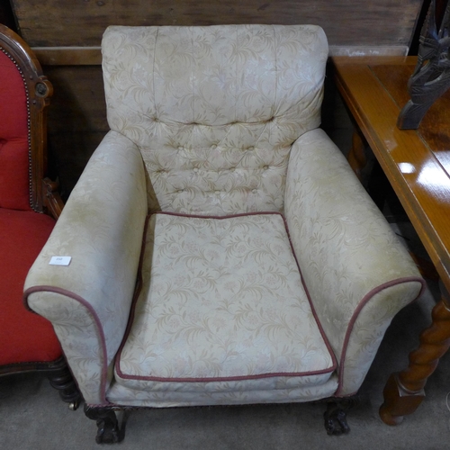 250 - An early 20th Century Chippendale Revival carved mahogany and fabric upholstered armchair