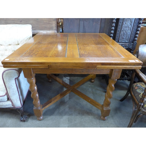 253 - An oak barleytwist draw-leaf table