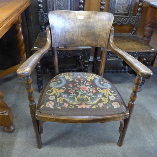 255 - An early 20th Century beech bentwood elbow chair