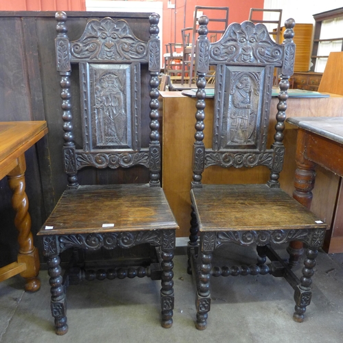 256 - A pair of 19th Century Flemish carved oak side chairs