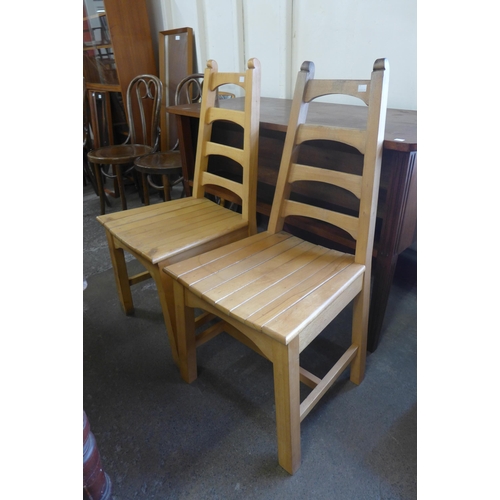 258B - A pair of Arts and Crafts beech side chairs