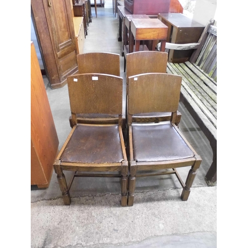 307 - A set of four oak dining chairs