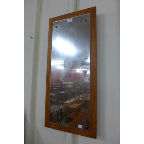 31 - A teak framed mirror