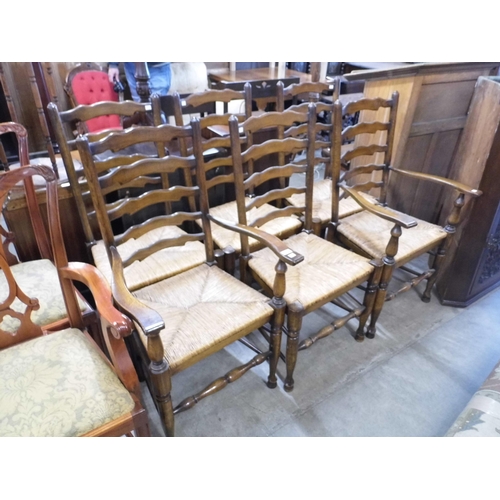 312 - A set of six of George III style oak rush seated ladderback chairs